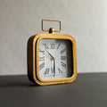 Henrie Rounded Brass Tabletop Clock With Handle And Glass